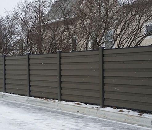Residential Trex composite fence with vertical boards