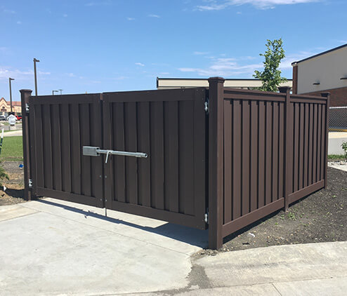 Commercial composite dumpster enclosure with gate and secure latch
