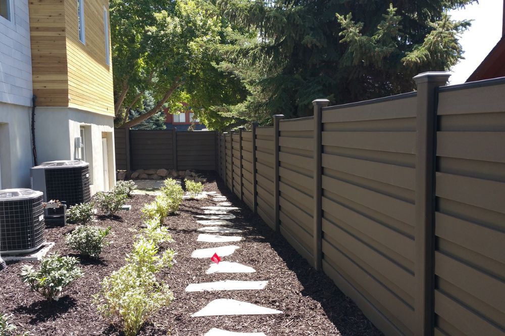 Trex low-maintenance composite fencing running along a property line.